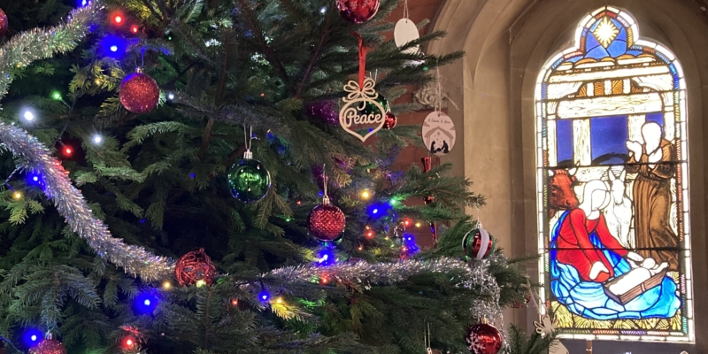 Christmas tree and stained glass nativity window 